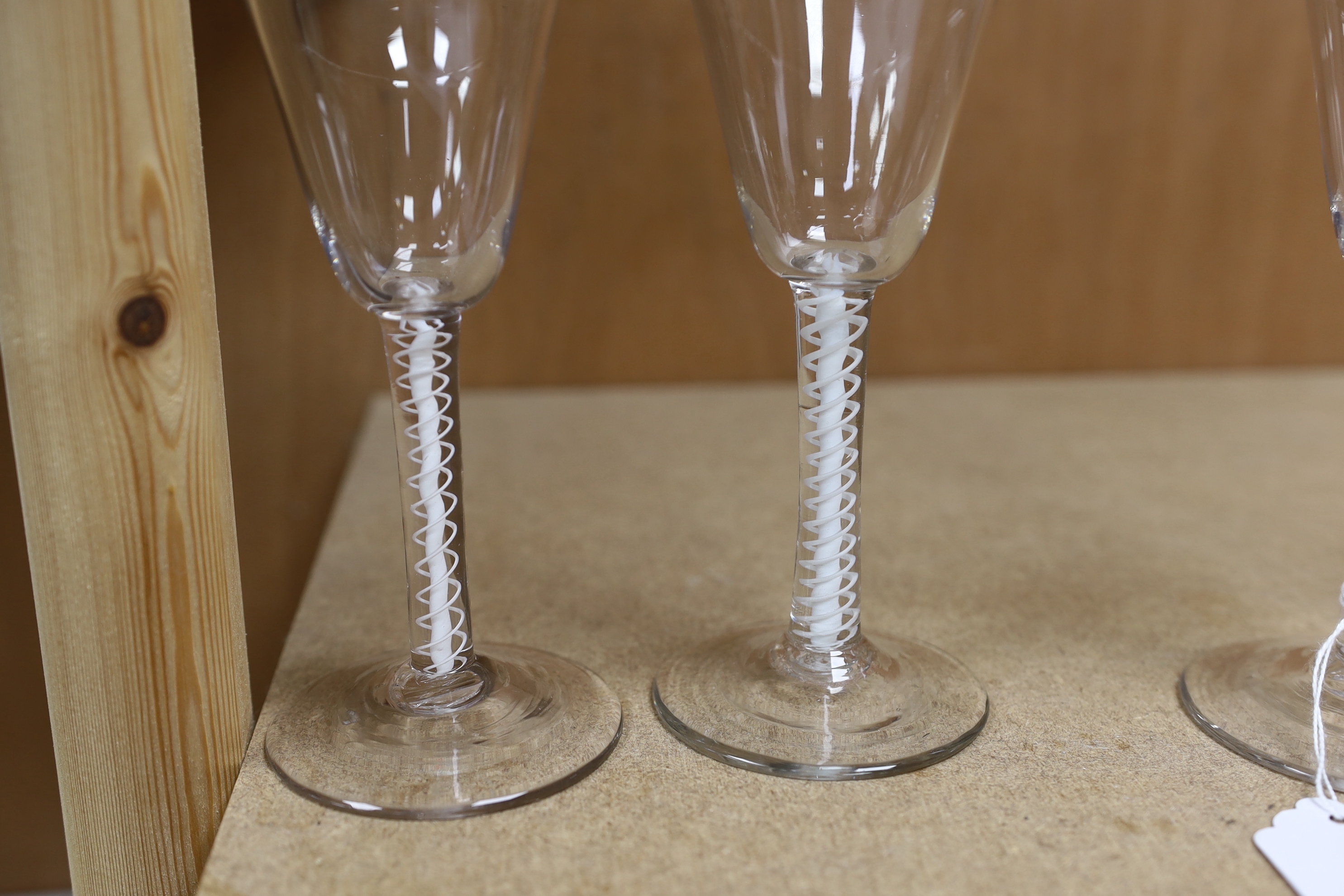 A set of six mid 18th century opaque twist stemmed wine glasses (one a.f.)